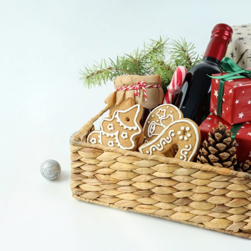 Concept of gift with Christmas basket on white background